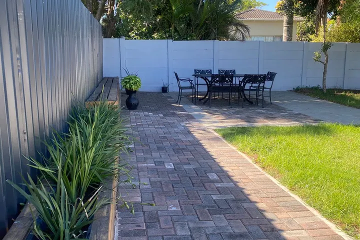 Outdoor seating and garden area at Fusion House